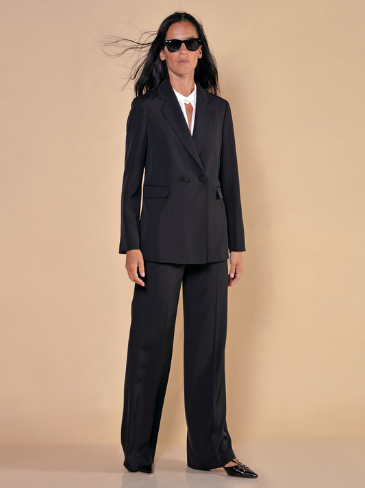 Double-breasted jacket with side slits in black fluid fabric